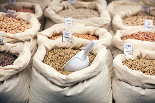 Various grains in bags at spanish market